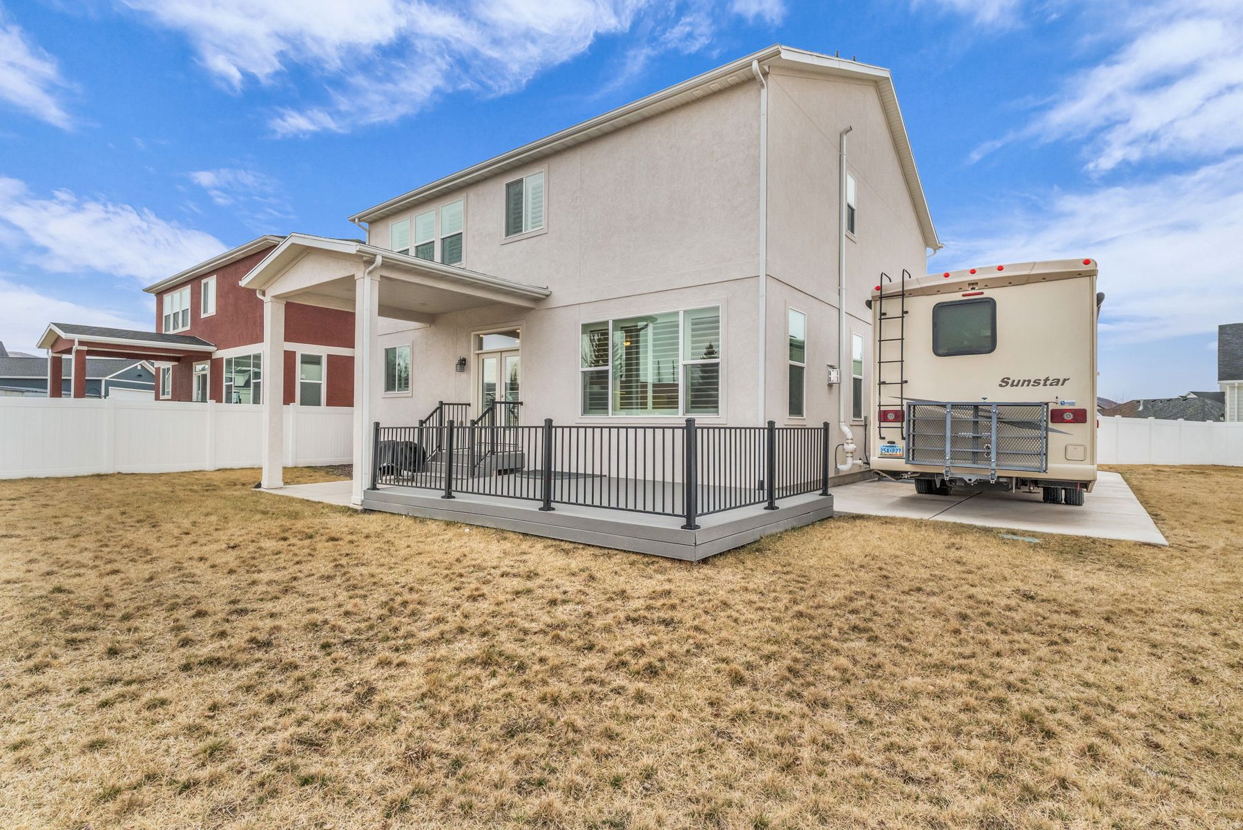 Backyard of 1243 S 1040 E Heber City with covered deck fenced yard and RV parking